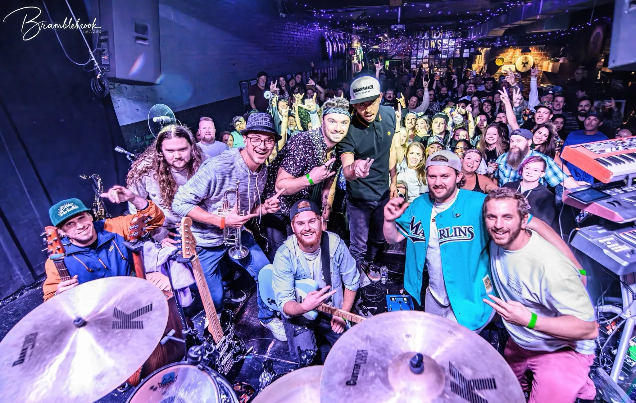 Jacob and his band on stage with the crowd after a club show